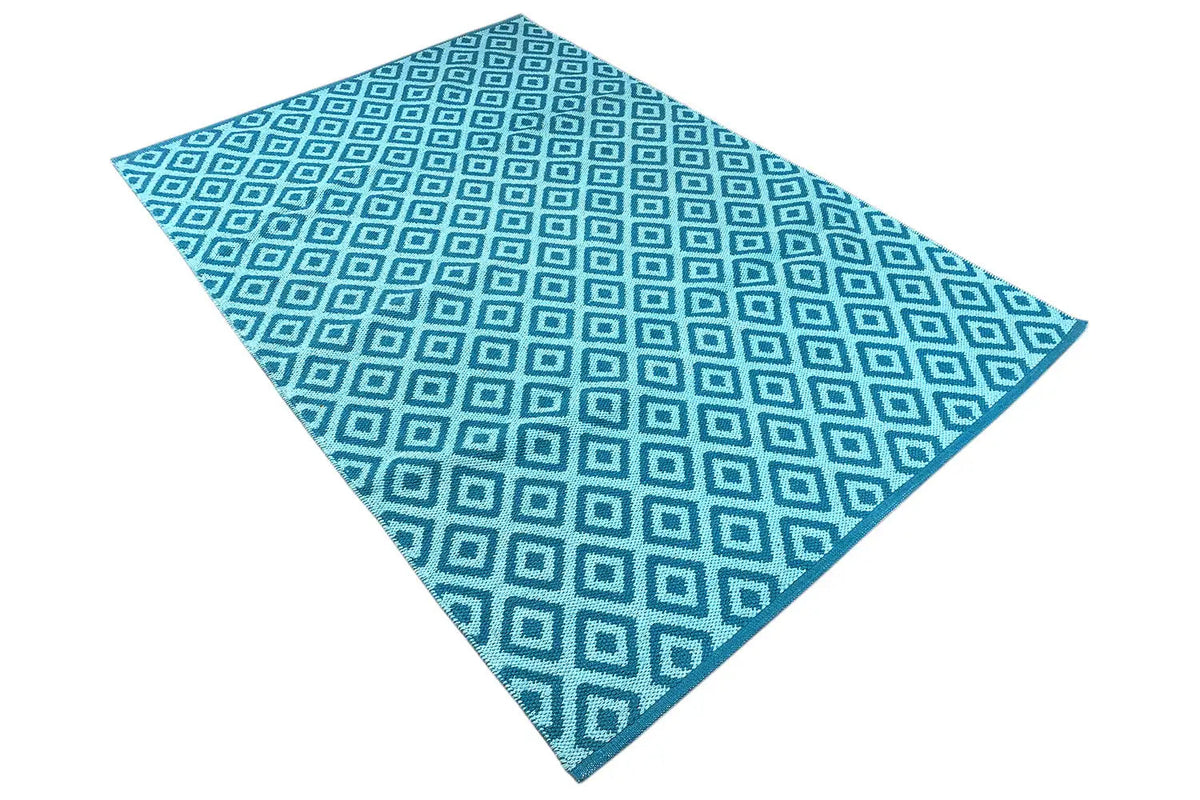 Foldable blue kilim with a square grid pattern and light blue outlines