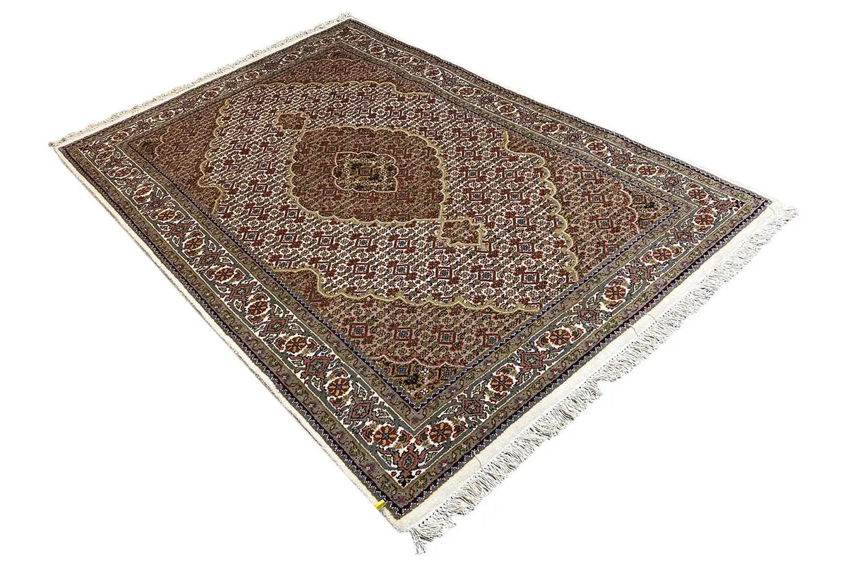 Oriental rug laid diagonally with an ornamental pattern and decorative border trim