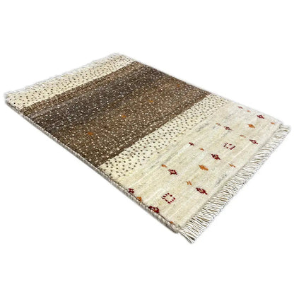 Gabbeh rug with a diagonal brown field, cream-colored background, and colorful patterns