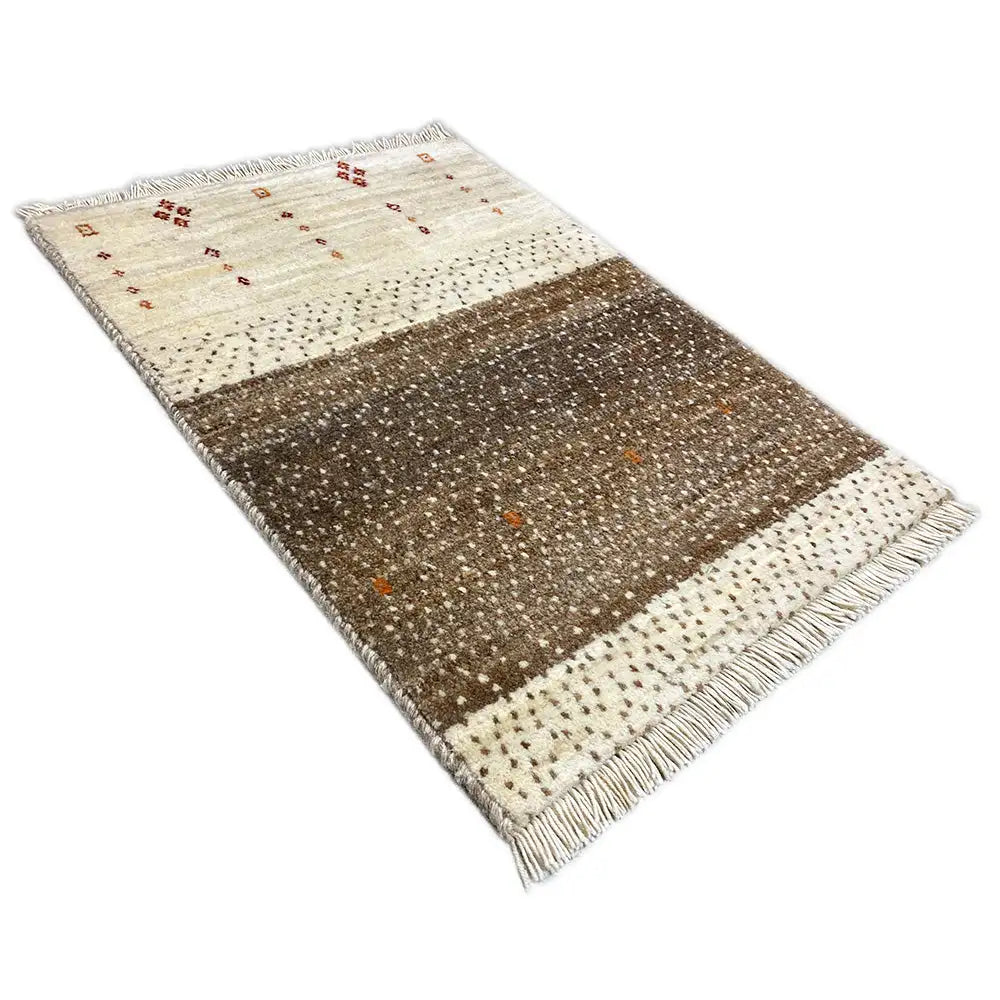 Gabbeh rug 58x43 cm, diagonal view with fringe and a cream-brown pattern