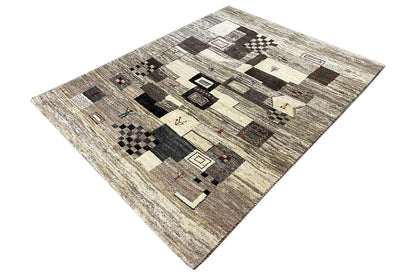 Gabbeh rug with diamond and tile patterns in gray, beige, and dark brown