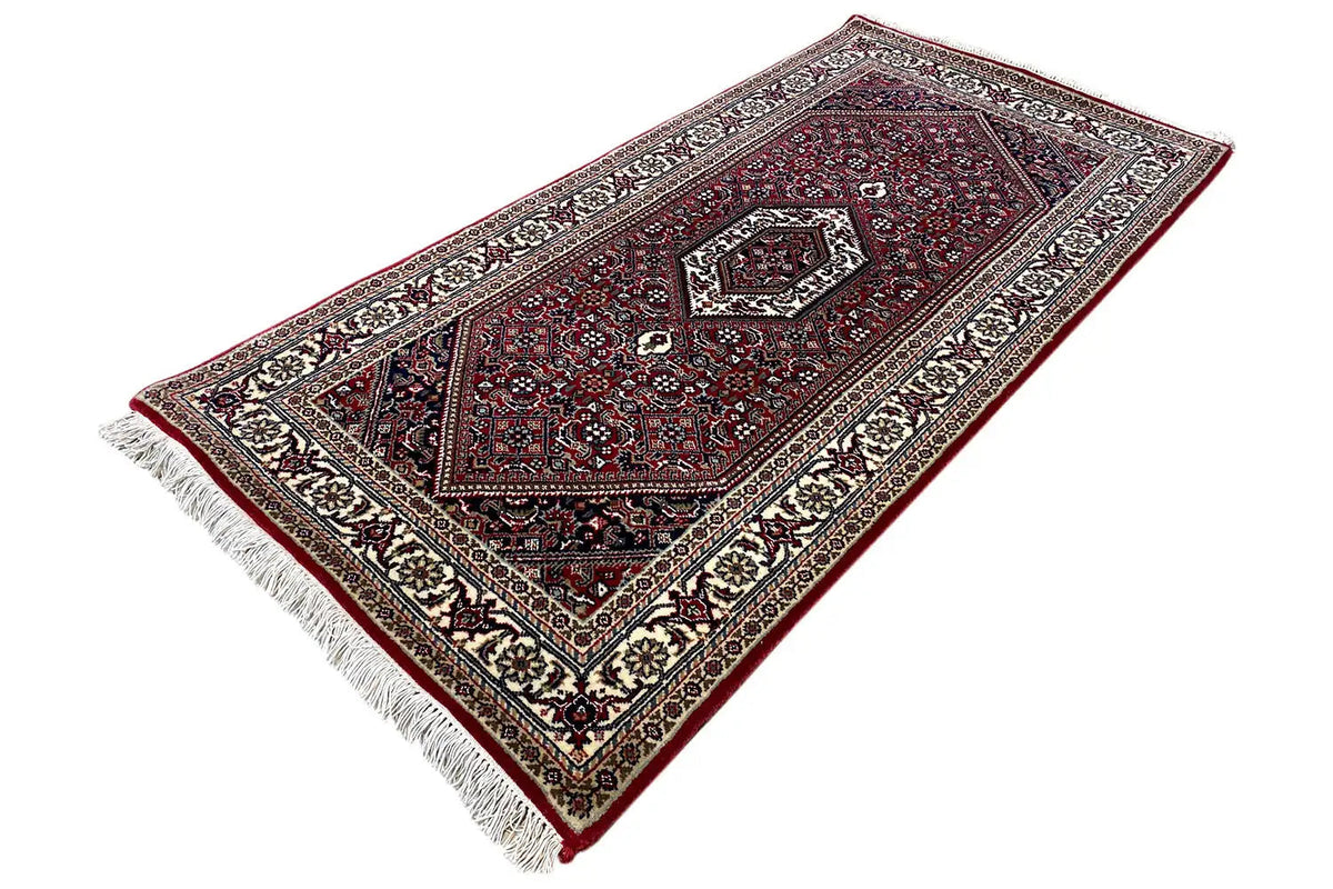 Bidjar rug, cream-and-black border frame, dark red, fringes