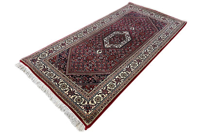 Bidjar rug, cream-and-black border frame, dark red, fringes