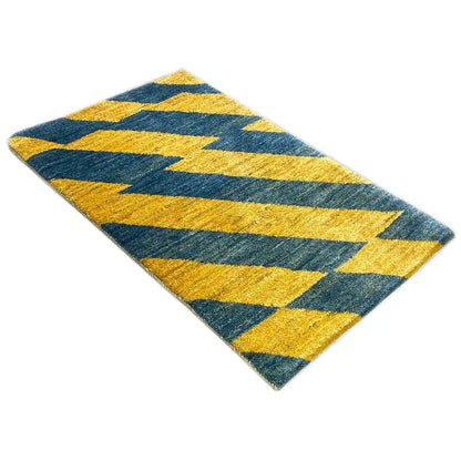Rectangular Gabbeh rug made of virgin wool, with diagonal yellow and blue zigzag stripes