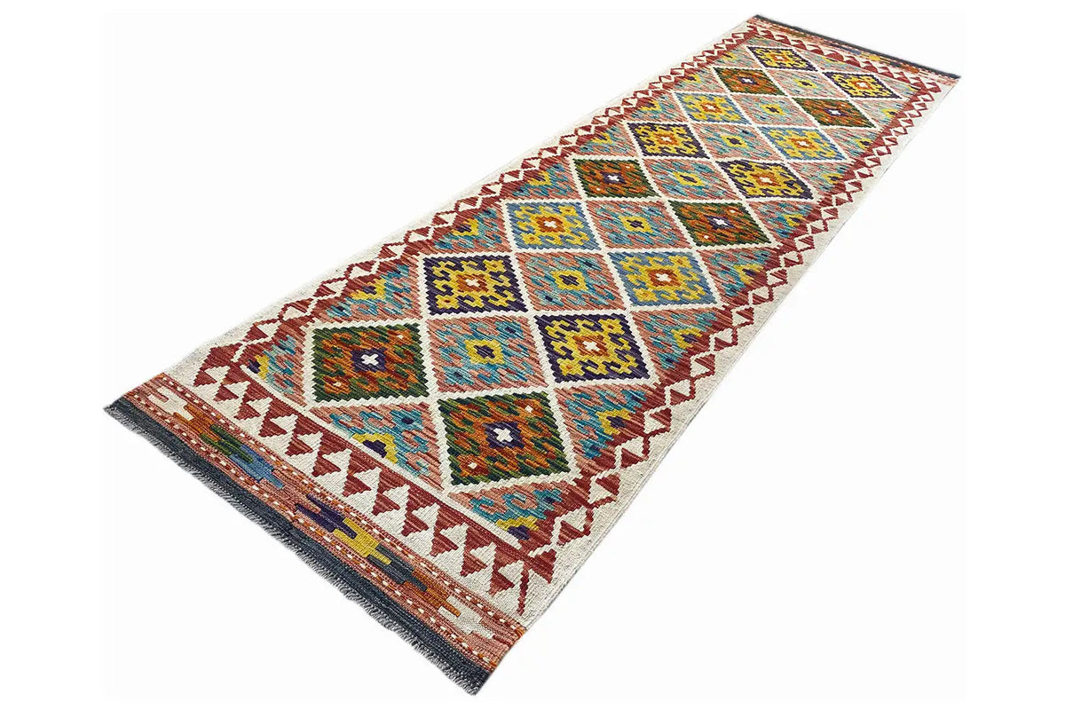 Kilim runner from a perspective view, diamond and zigzag patterns in blue and red