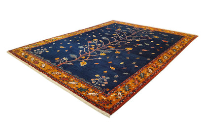 Oriental rug with dark blue and orange-brown border, featuring tree motifs
