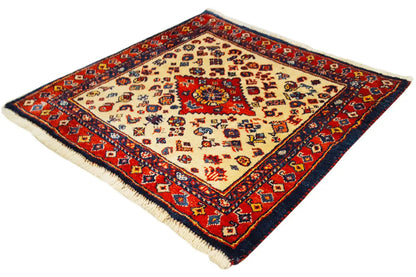 Qashqai exclusive rug with a red, blue, and beige pattern, surrounded by a border