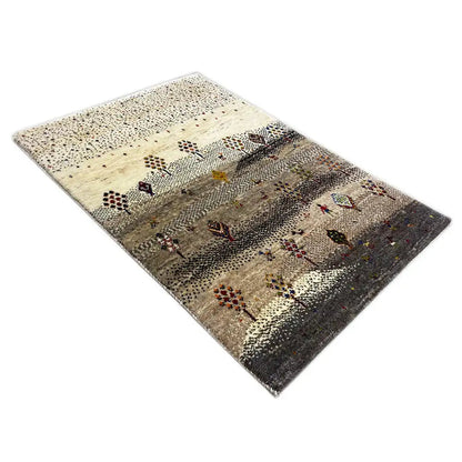 Gabbeh rug at an oblique angle, beige background with colorful rows and motifs