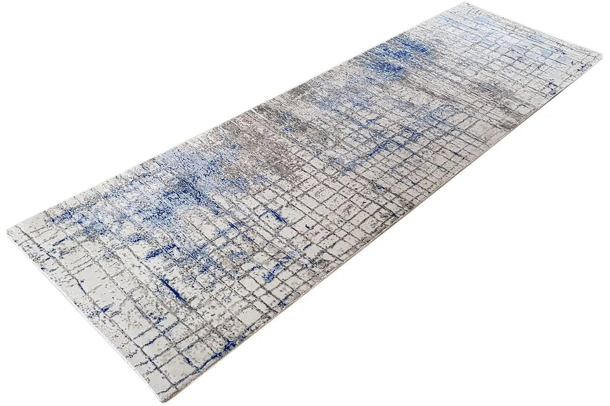 Long-format rug with an abstract grid pattern in light gray and blue