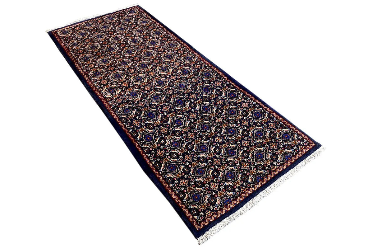 Moud rug, diagonal: dark blue-brown pattern with a reddish mid-tone