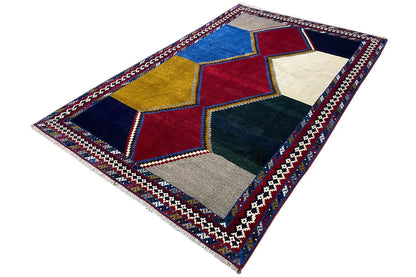 Rug with diagonally arranged patchwork of squares and diamonds, multicolored border