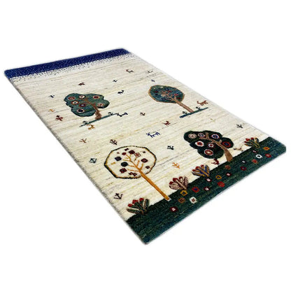 Gabbeh rug with a blue border, cream background, and colorful tree and animal motifs