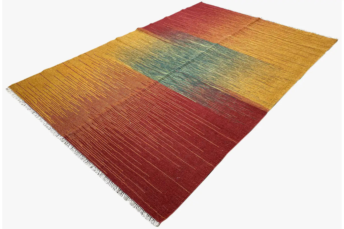 Kelim rug with color blocks in mustard, burgundy, and petrol, with a clearly visible pile