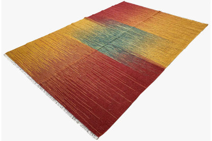 Kelim rug with color blocks in mustard, burgundy, and petrol, with a clearly visible pile
