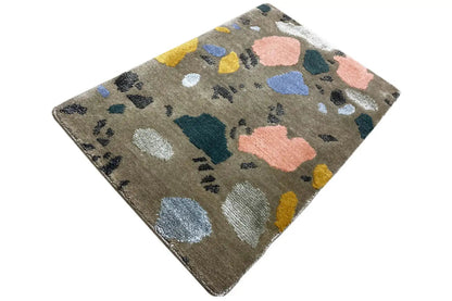 Beige carpet with colorful geometric spots and a small dotted pattern, rotated