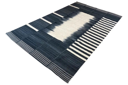 Modern kilim with a central motif in cream and dark blue patchwork stripes