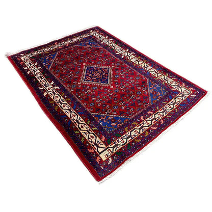 Oriental rug with a dark red background, blue central field, and woven borders, rectangular