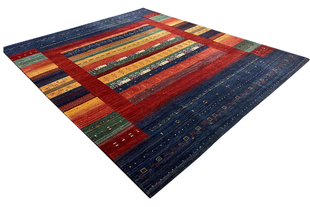 Rug with a wide central border in red, blue, yellow, and green