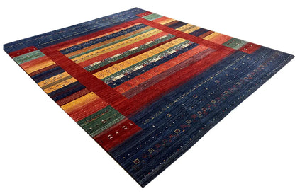 Rug with a wide central border in red, blue, yellow, and green