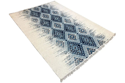 Angled kelim dhurrie rug, blue diamond pattern on a light background, fringes