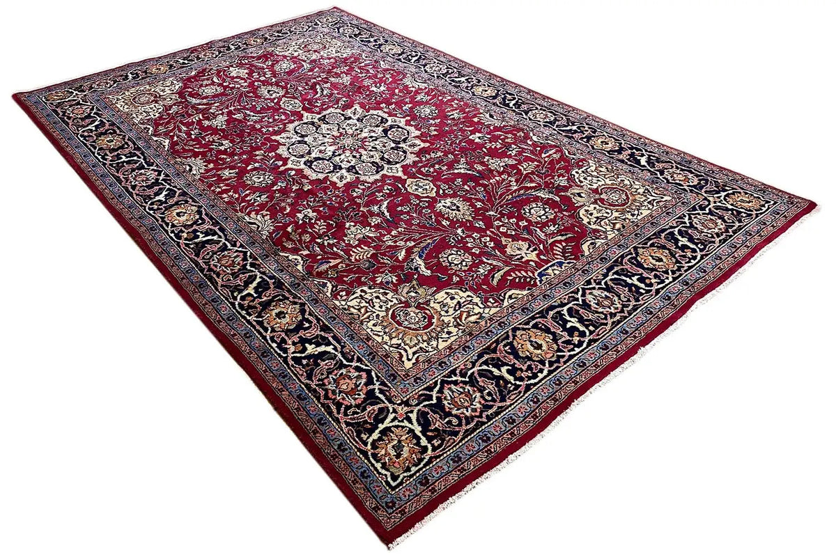 Khorasan rug: diagonal view, red field with ornaments and a dark patterned border.