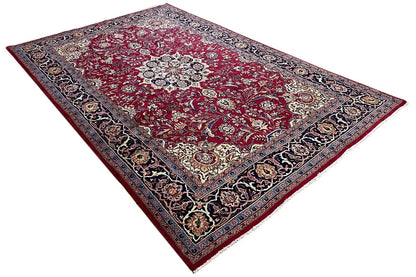 Khorasan rug: diagonal view, red field with ornaments and a dark patterned border.