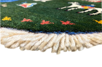 Round rug 96x96 cm: fringes along the edge, colorful green embroidery