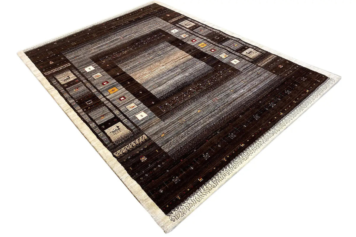 Gabbeh rug with muted gray in the center, dark brown borders, and accent colors