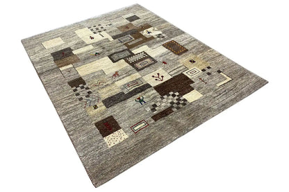 Gabbeh rug with a patchwork pattern in gray and beige made up of various rectangles