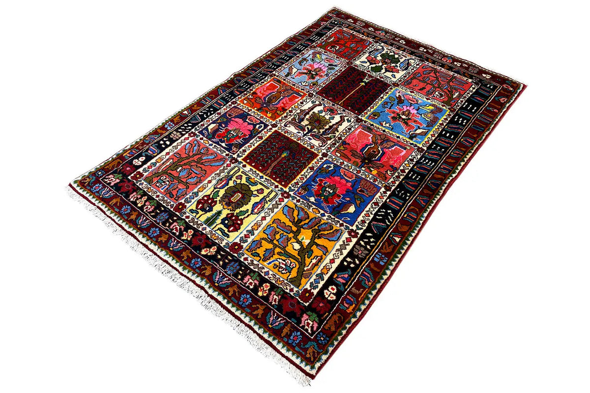 Rectangular rug laid out, patterned sections in red, blue, yellow, and green