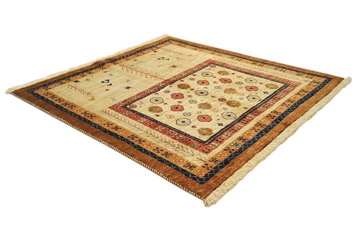 Rectangular rug with a cream central motif and red-and-blue border, shown at an angle