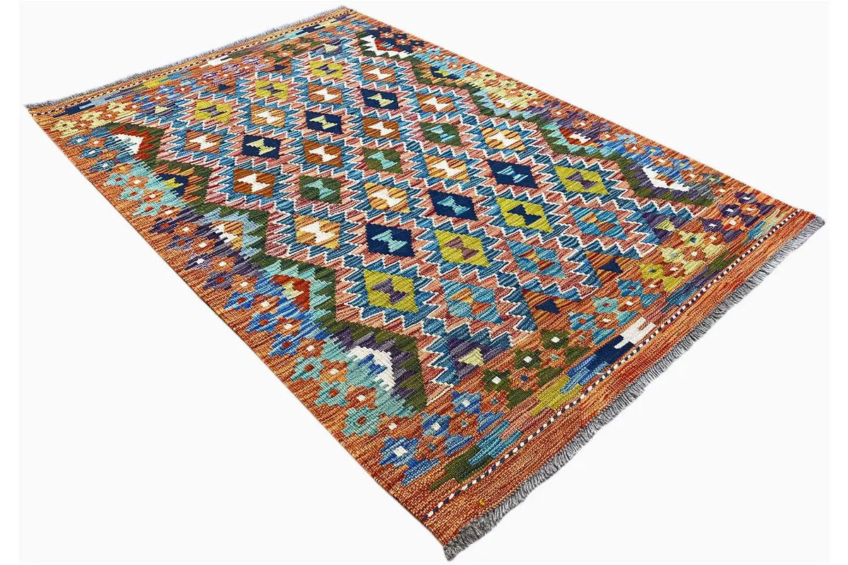 Afghan kilim rug 150x102 cm, lying at an angle with colorful wedge and diamond patterns