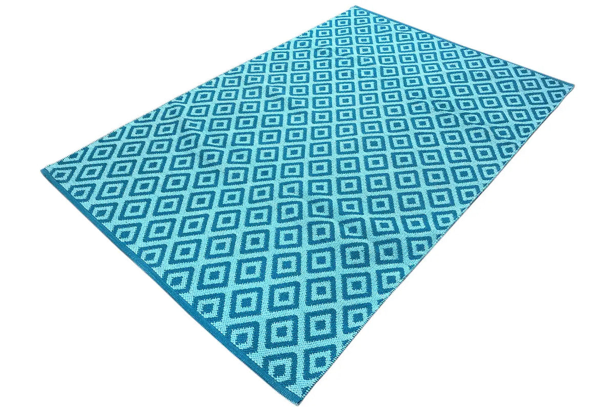 Blue kilim with a square pattern alternating between light blue and dark blue