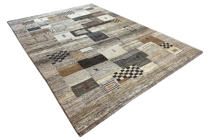 Gabbeh rug with a patchwork look made of rectangles and squares, from light gray to beige