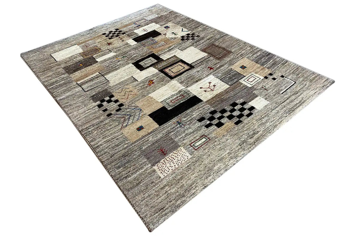 Rug with a graphic pattern of squares and rectangles in beige, gray, and black