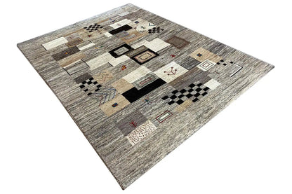 Rug with a graphic pattern of squares and rectangles in beige, gray, and black