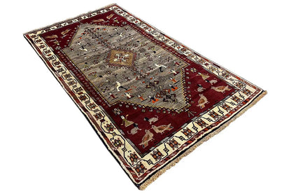 Gabbeh rug border with a woven texture, red-gray pattern, and decorative edging