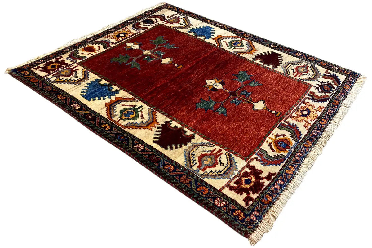 Poshti Qashqai rug 94x80 cm at an angle, red field with an ornamental cross motif