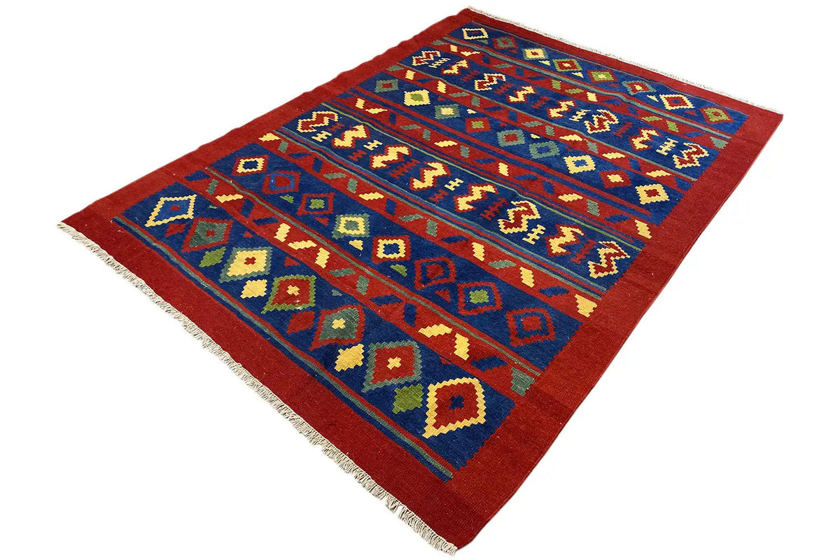 Kilim rug with a blue patterned band, red areas, and colorful diamonds