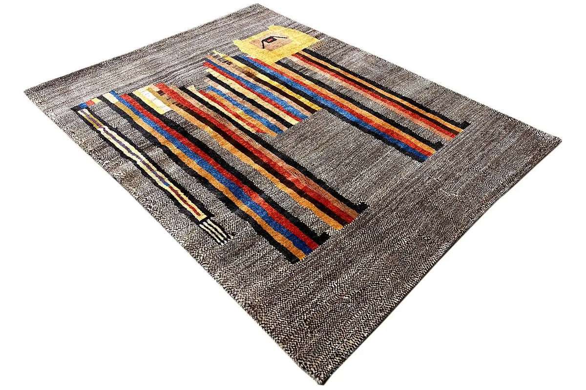 Low-pile rug in an angled format: gray base with colorful stripes and a yellow detail.