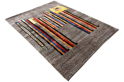 Low-pile rug in an angled format: gray base with colorful stripes and a yellow detail.