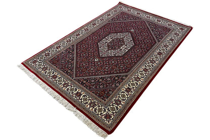 Bidjar Oriental rug, fringes at the corner; central diamond pattern in burgundy and cream