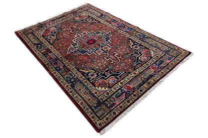 Hamadan rug with a red ornamental center and dark blue border