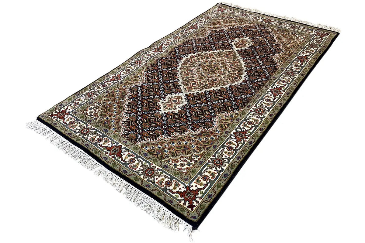 Indo Tabriz rug in an elongated view, central medallion, short fringes