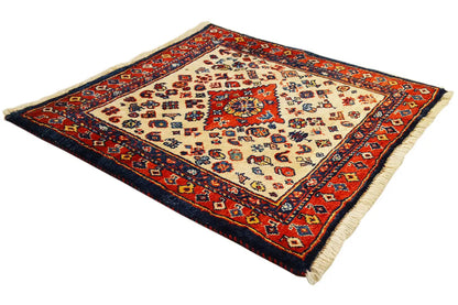 Qashqai exclusive rug with a red, blue, and beige pattern, rectangular border