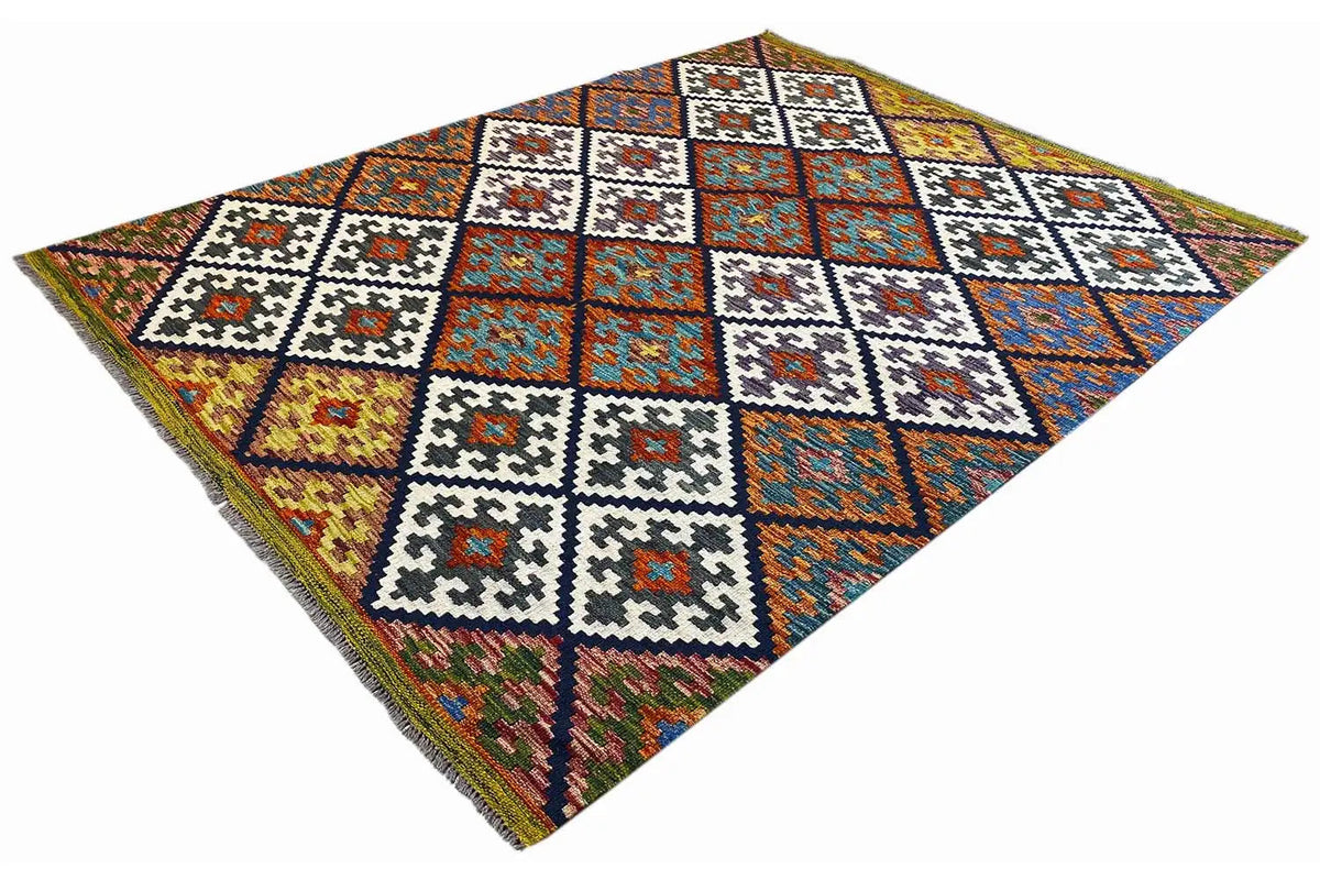 Kilim rug in three-quarter view with a colorful diamond layout