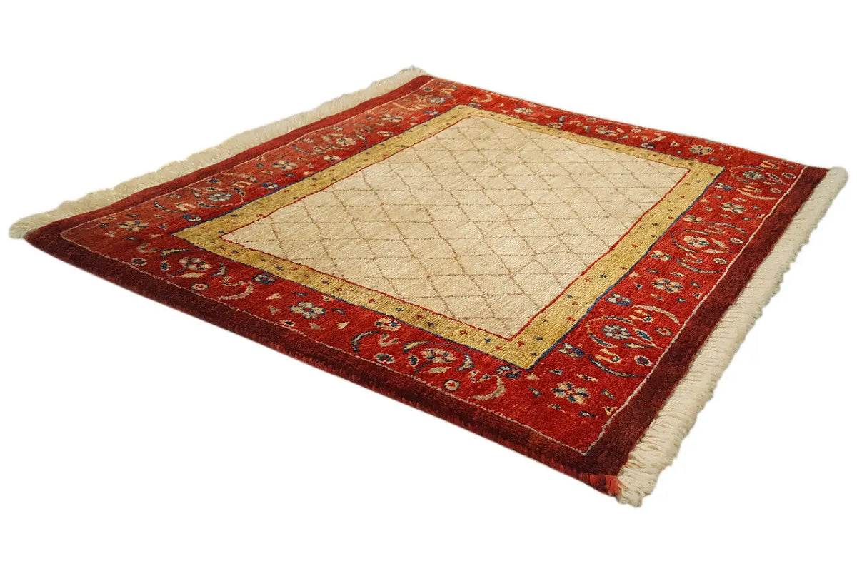 Rug with a red ornamental border, a beige central area, and a contrasting yellow border stripe.