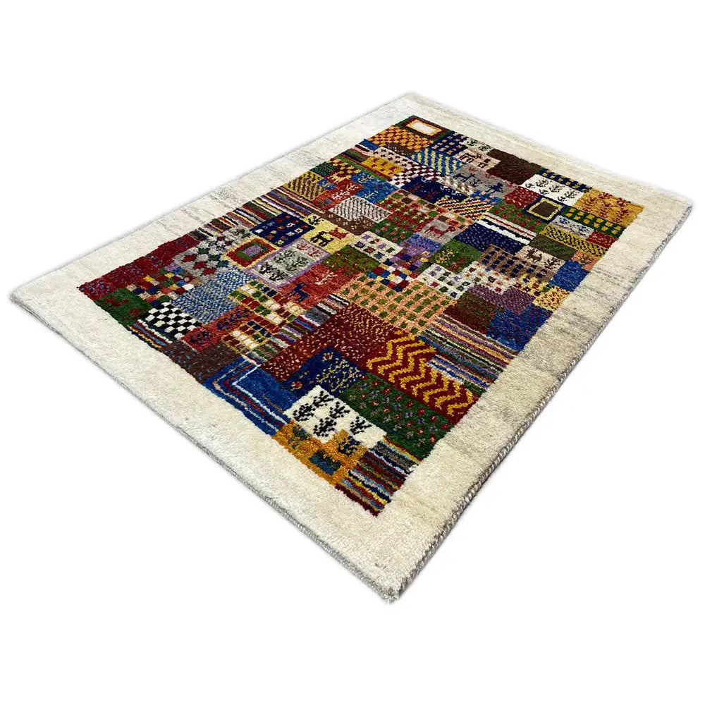 Landscape-oriented Gabbeh rug with a colorful square and line pattern on a light background