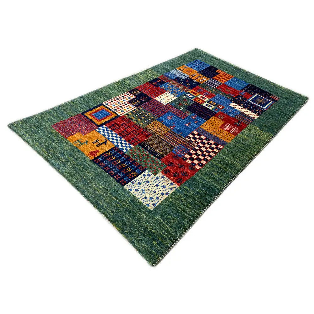 Gabbeh rug 96x60 cm with a square patchwork pattern in blue, red, and green