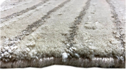 Close-up: Light gray carpet with a short pile and shimmering wave pattern